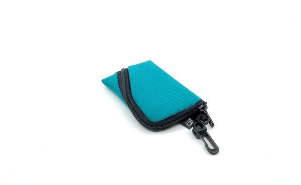 A Super Mini Ghost Whale Pouch in Mayura (teal blue).